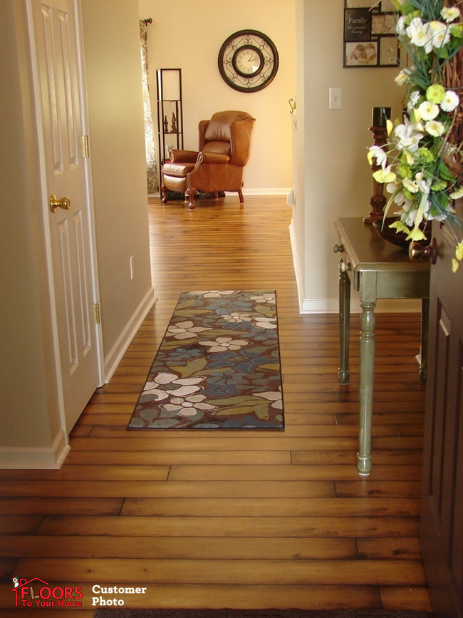 Planks installed perpendicular to the room's longer direction