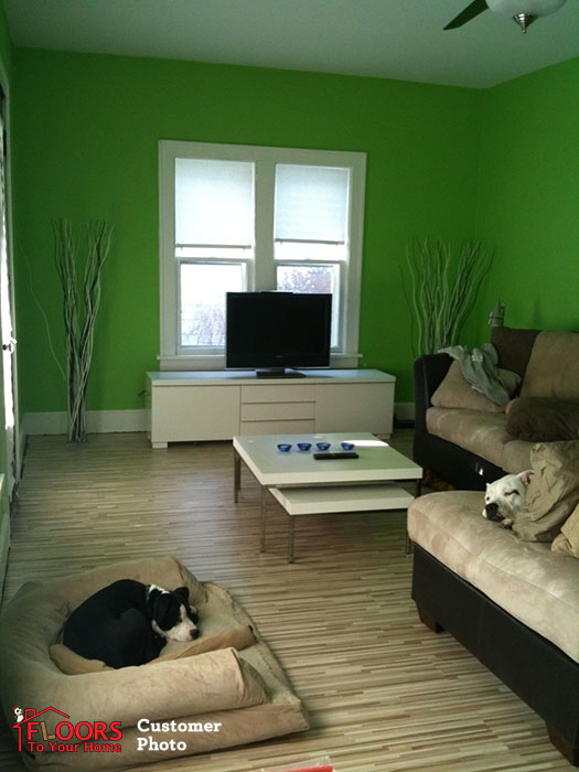 A content doggie relaxes on a multi-strip flooring installed by one of our customers.